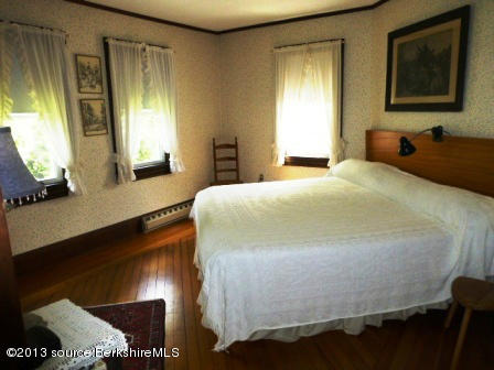 1475 Savoy Road Windsor, MA 01270 - Photo 35 of 61 a bedroom with a bed and wooden floor