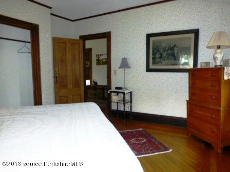 1475 Savoy Road Windsor, MA 01270 - Photo 38 of 61 a bedroom with a bed and wooden floor
