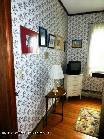 1475 Savoy Road Windsor, MA 01270 - Photo 42 of 61 a living room with furniture and a flat screen tv