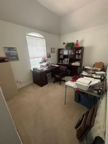 a view of a workspace with furniture