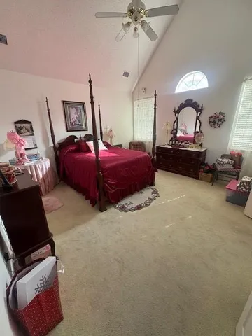 a bedroom with furniture and a chandelier