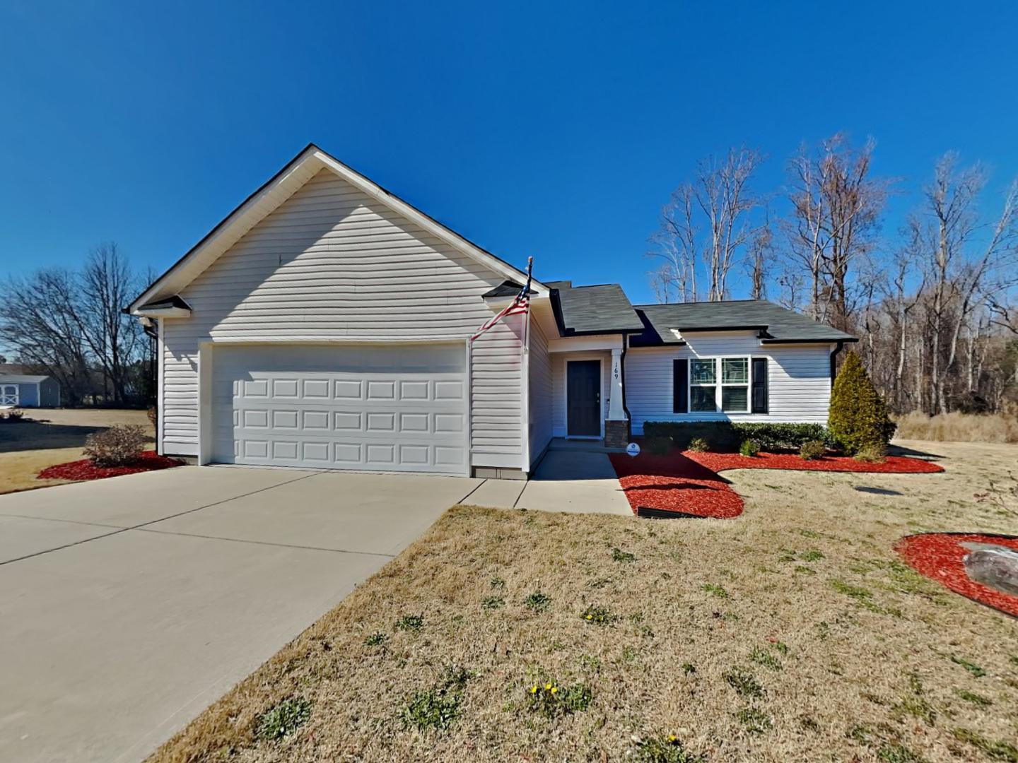 a front view of a house with outdoor seating