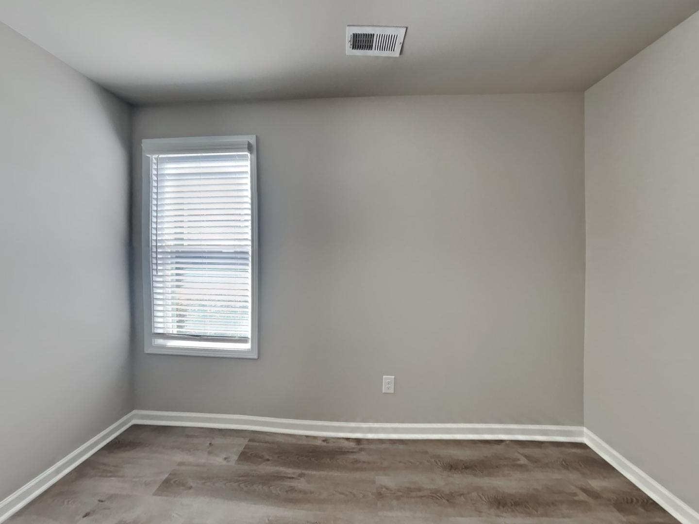 169 Willow Ridge Circle Willow Spring, NC 27592 - Photo 13 of 17 an empty room with a window