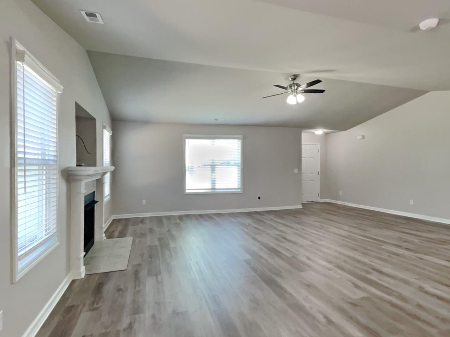 169 Willow Ridge Circle Willow Spring, NC 27592 - Photo 5 of 17 a view of empty room with wooden floor and fan