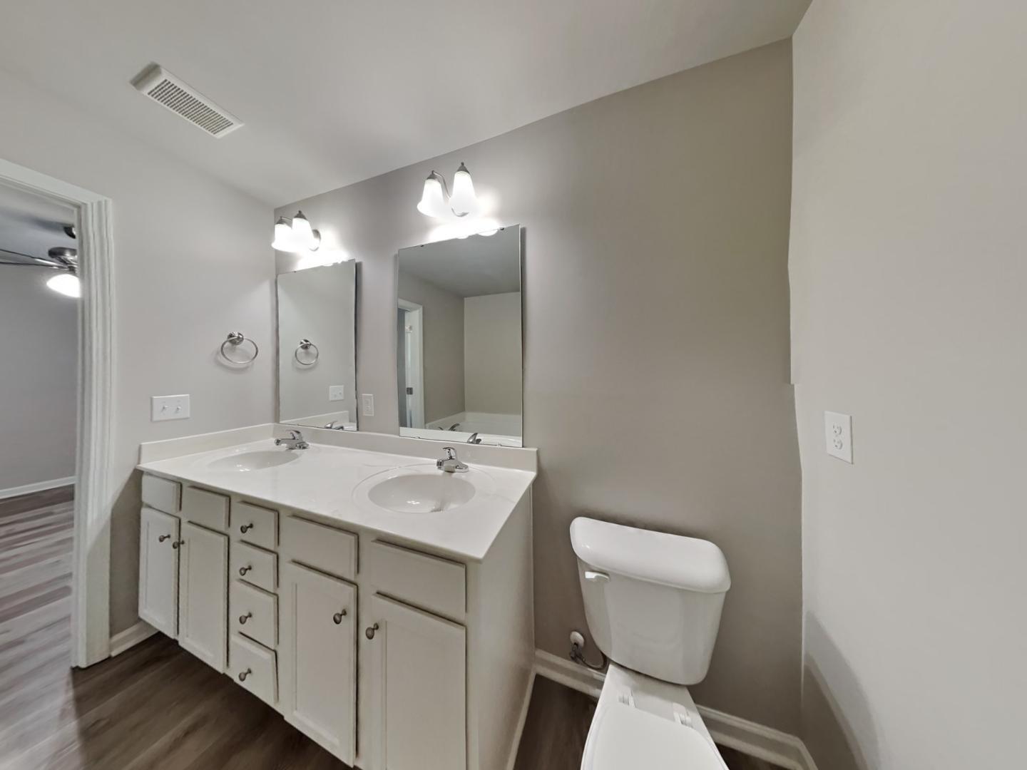 169 Willow Ridge Circle Willow Spring, NC 27592 - Photo 9 of 17 a bathroom with a toilet sink and mirror