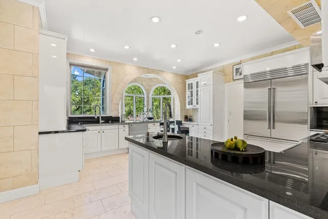a kitchen with sink and window