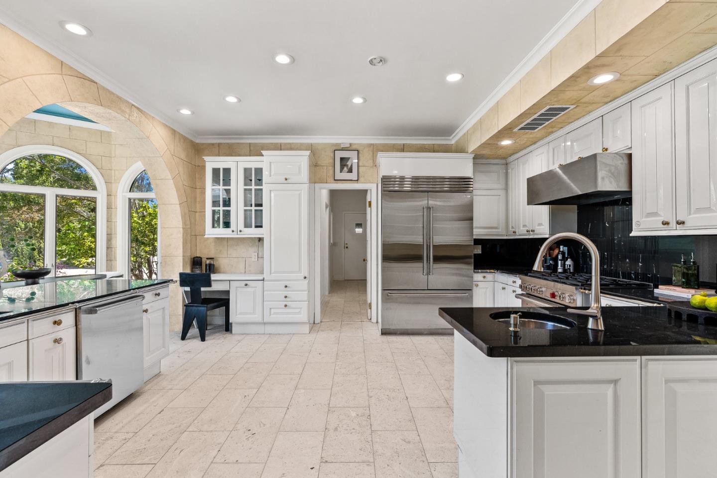 1142 Moore Road Woodside, CA 94062 - Photo 13 of 56 a kitchen with stainless steel appliances granite countertop a sink and cabinets