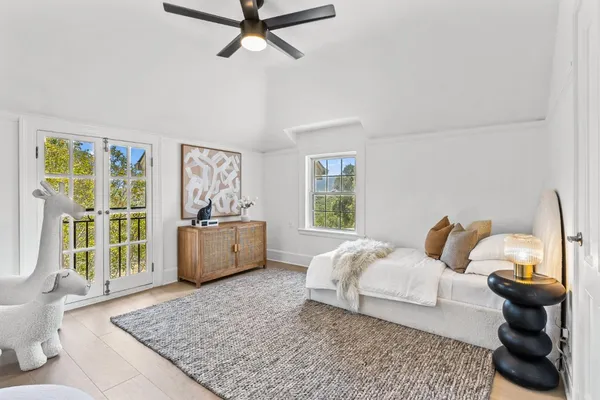 an outdoor sitting area with furniture and a potted plant
