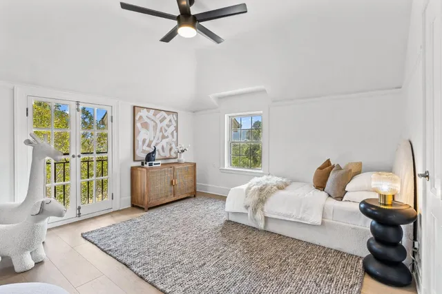 an outdoor sitting area with furniture and a potted plant