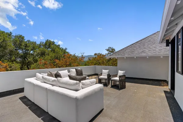 a view of a backyard with sitting area