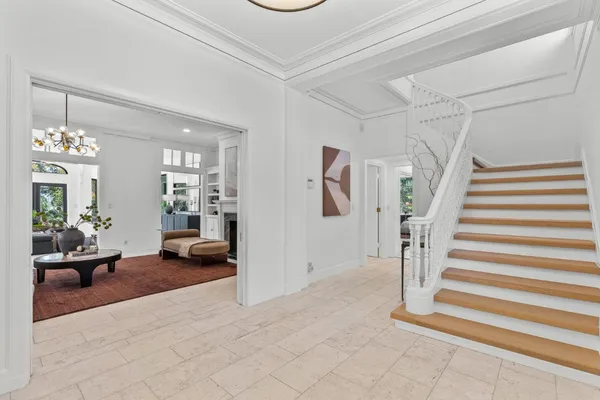 a view of a livingroom with entryway and furniture