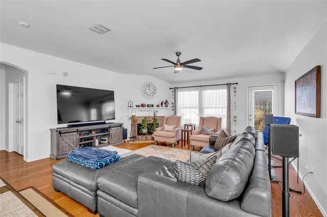 a bedroom with a bed and a dresser with mirror