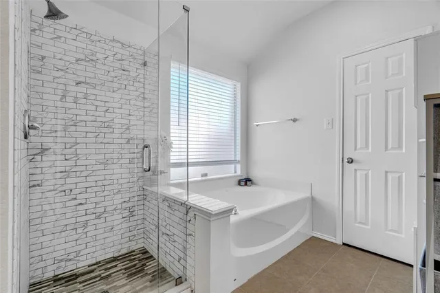 a view of a patio with dining table and chairs with wooden fence