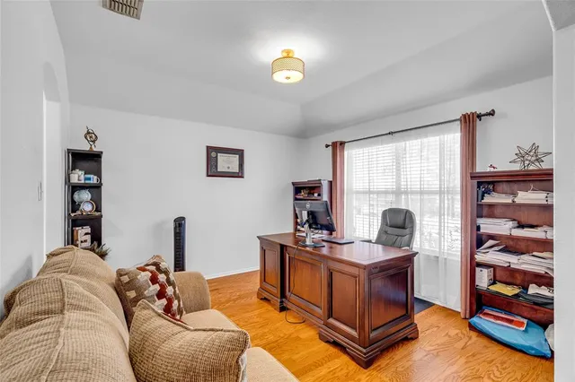 a view of a kitchen with kitchen island stainless steel appliances refrigerator stove microwave and cabinets