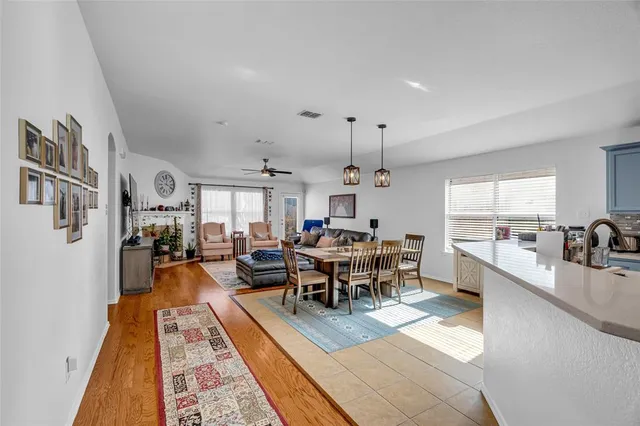 a kitchen with a sink a stove and cabinets