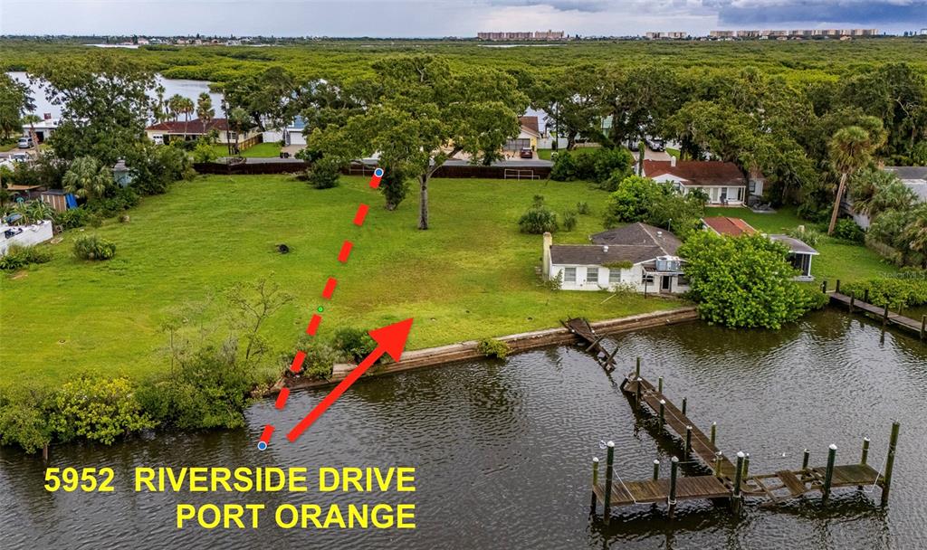 5952 Riverside Drive Port Orange, FL 32127 - Photo 1 of 1 a view of a city and lake