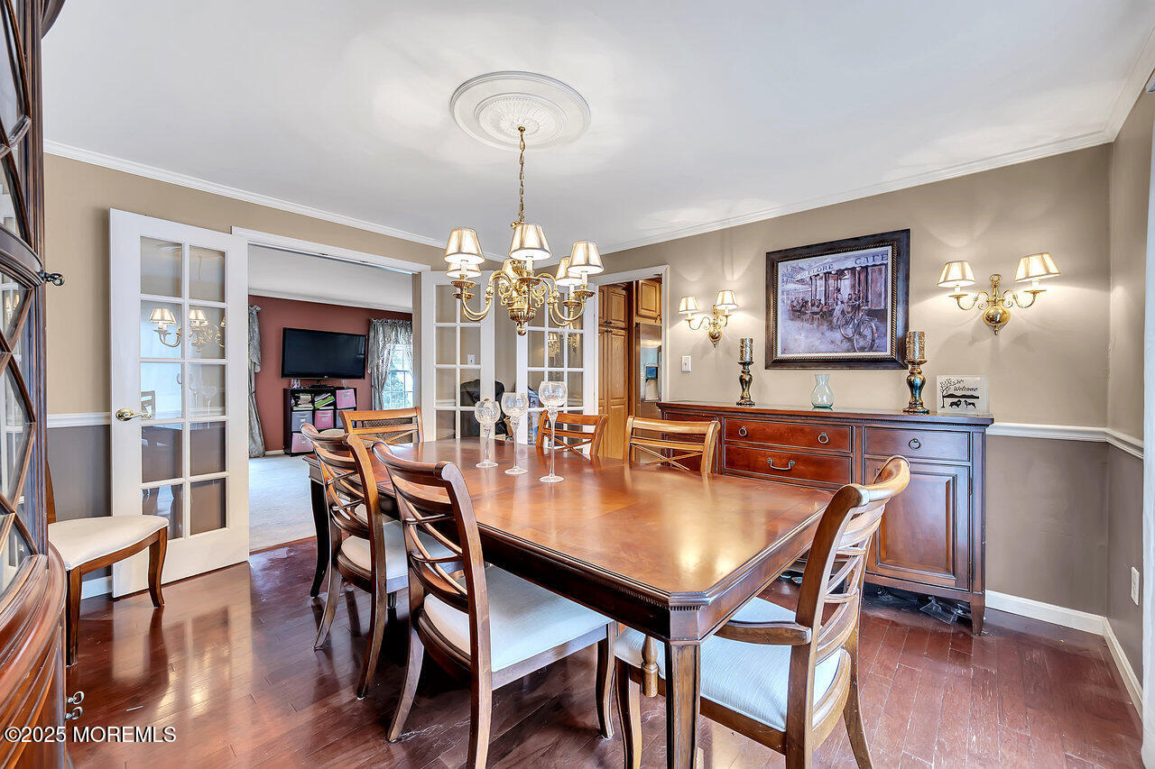 4 Cranberry Court Cream Ridge, NJ 08514 - Photo 12 of 51 a view of a dining room with furniture wooden floor and chandelier