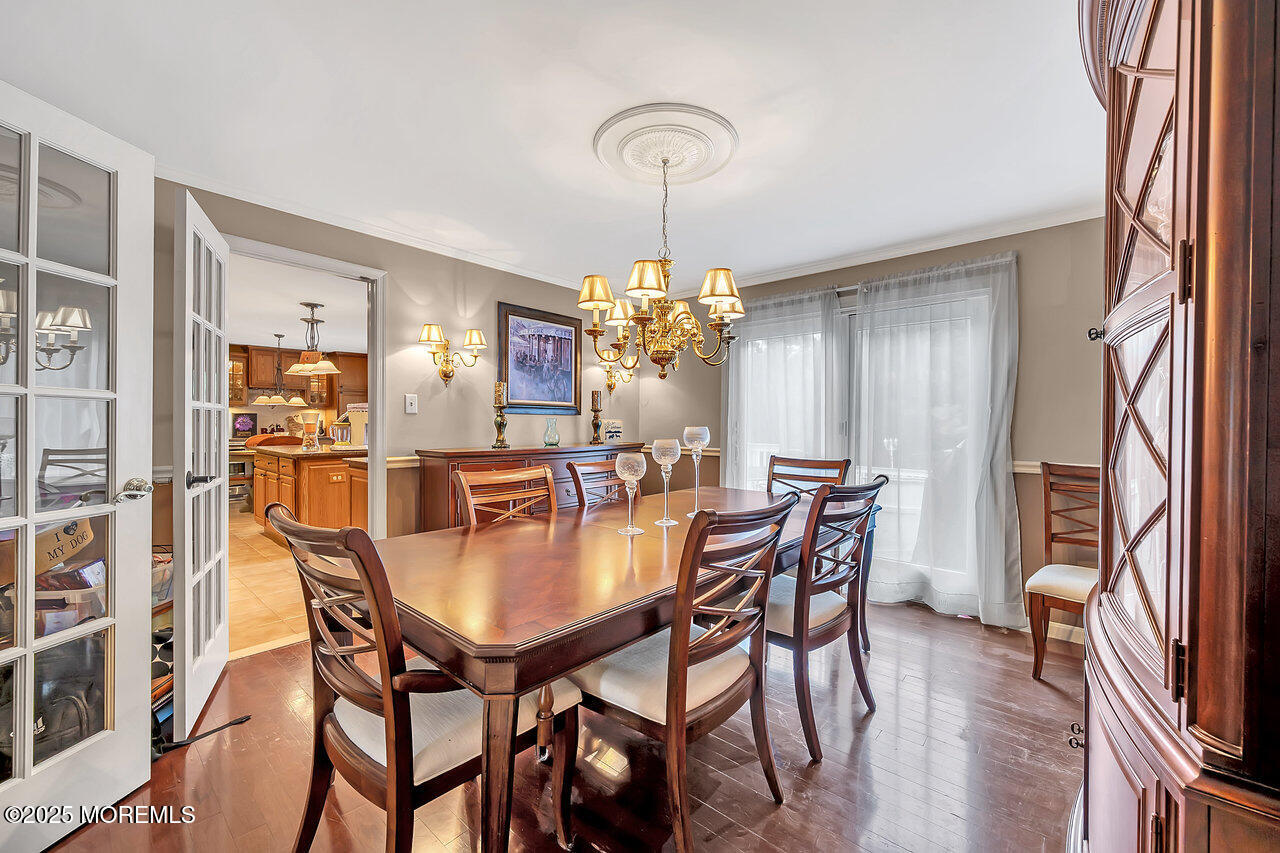 4 Cranberry Court Cream Ridge, NJ 08514 - Photo 13 of 51 a dining room with furniture a chandelier and wooden floor