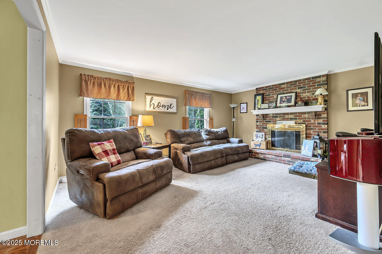 4 Cranberry Court Cream Ridge, NJ 08514 - Photo 14 of 51 a living room with furniture and a fireplace