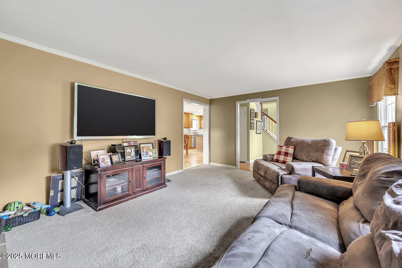 4 Cranberry Court Cream Ridge, NJ 08514 - Photo 15 of 51 a living room with furniture and a flat screen tv