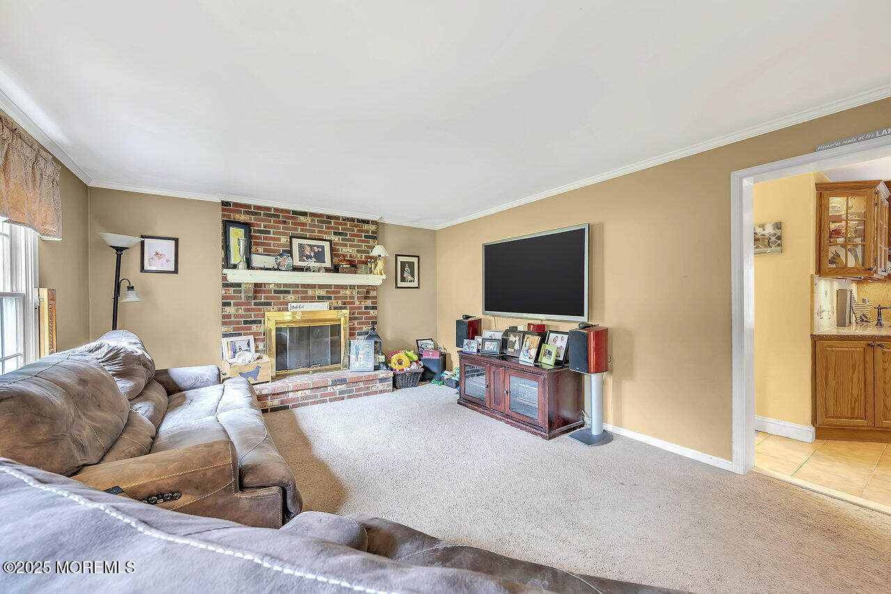 4 Cranberry Court Cream Ridge, NJ 08514 - Photo 16 of 51 a living room with furniture and a flat screen tv
