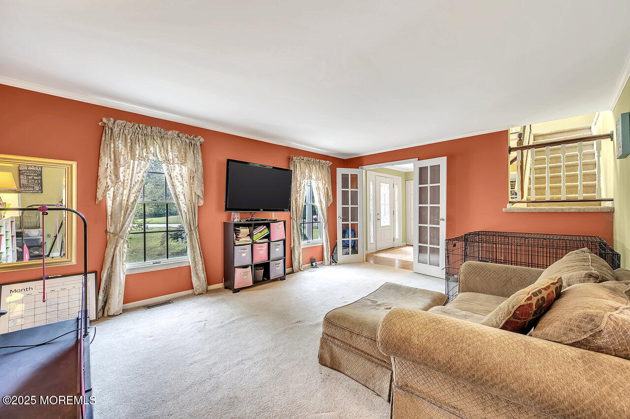 4 Cranberry Court Cream Ridge, NJ 08514 - Photo 17 of 51 a living room with furniture and a flat screen tv