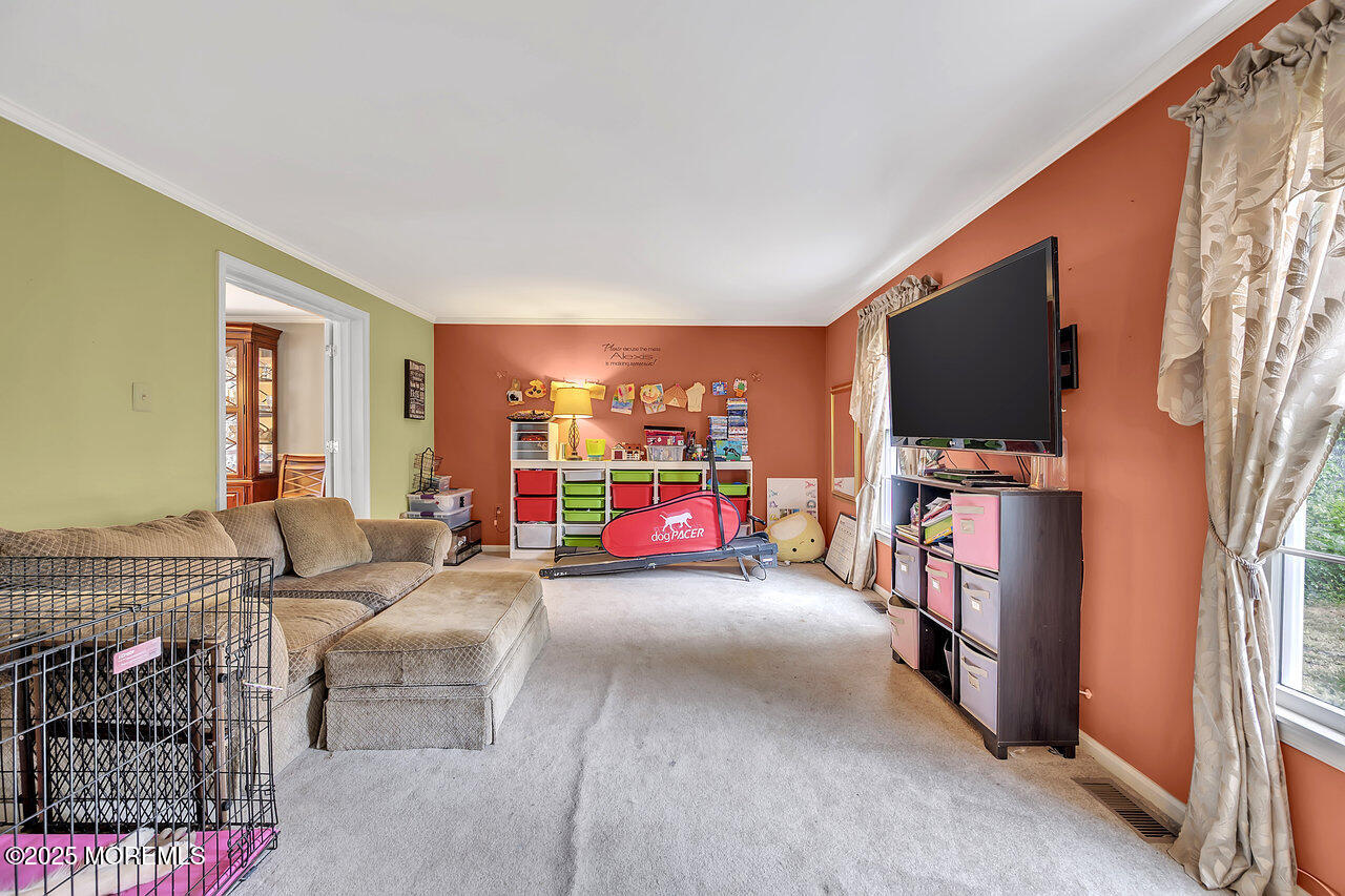 4 Cranberry Court Cream Ridge, NJ 08514 - Photo 18 of 51 a living room with furniture and a flat screen tv