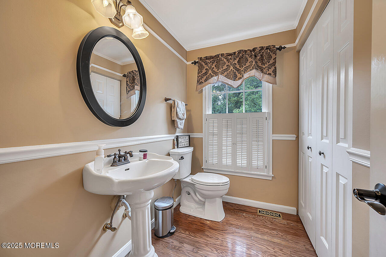 4 Cranberry Court Cream Ridge, NJ 08514 - Photo 22 of 51 a bathroom with a sink a mirror and a window