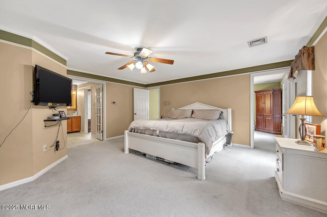 4 Cranberry Court Cream Ridge, NJ 08514 - Photo 23 of 51 a spacious bedroom with a bed and a flat screen tv