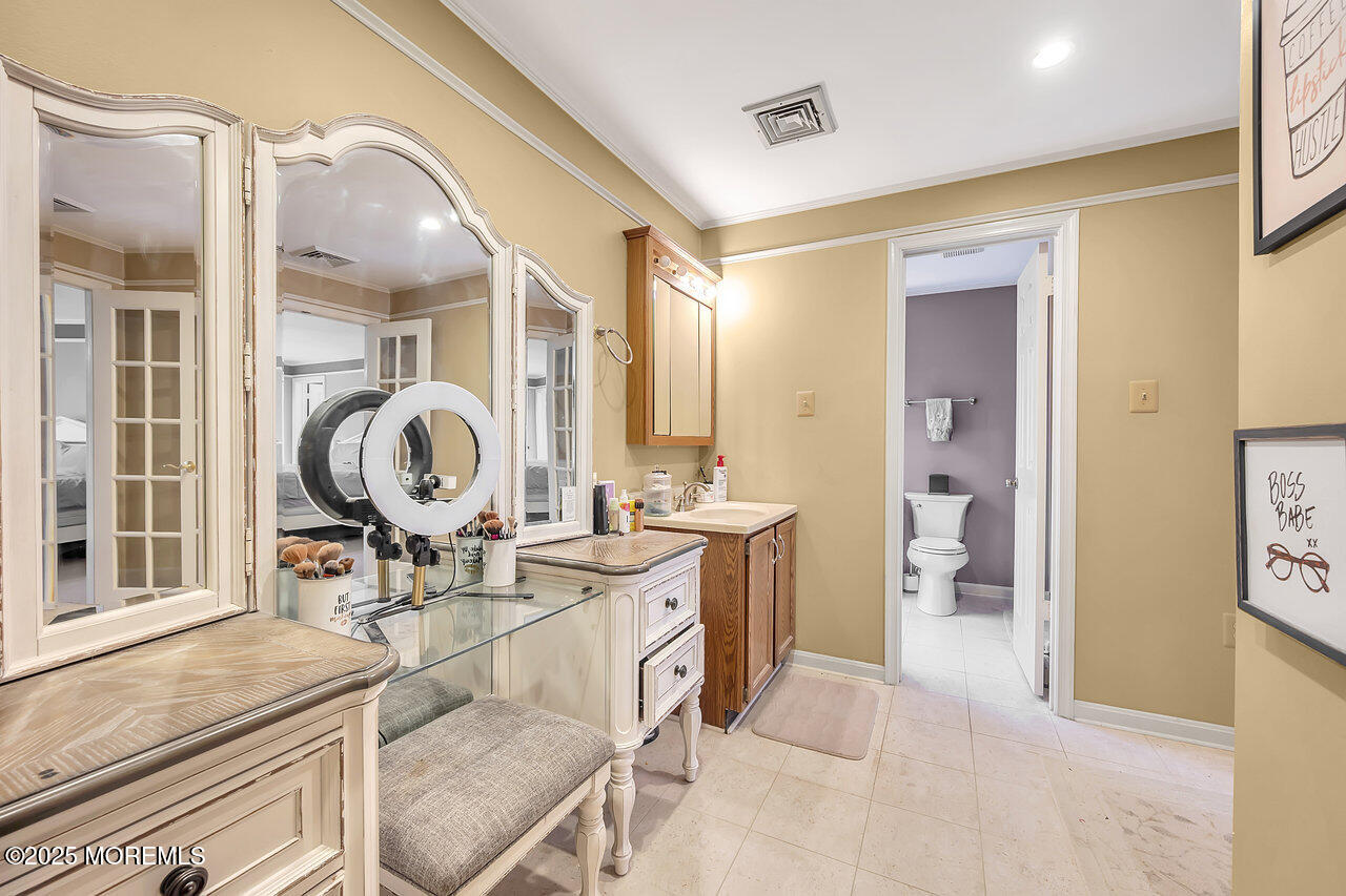 4 Cranberry Court Cream Ridge, NJ 08514 - Photo 26 of 51 a living room with a table chairs and a large window