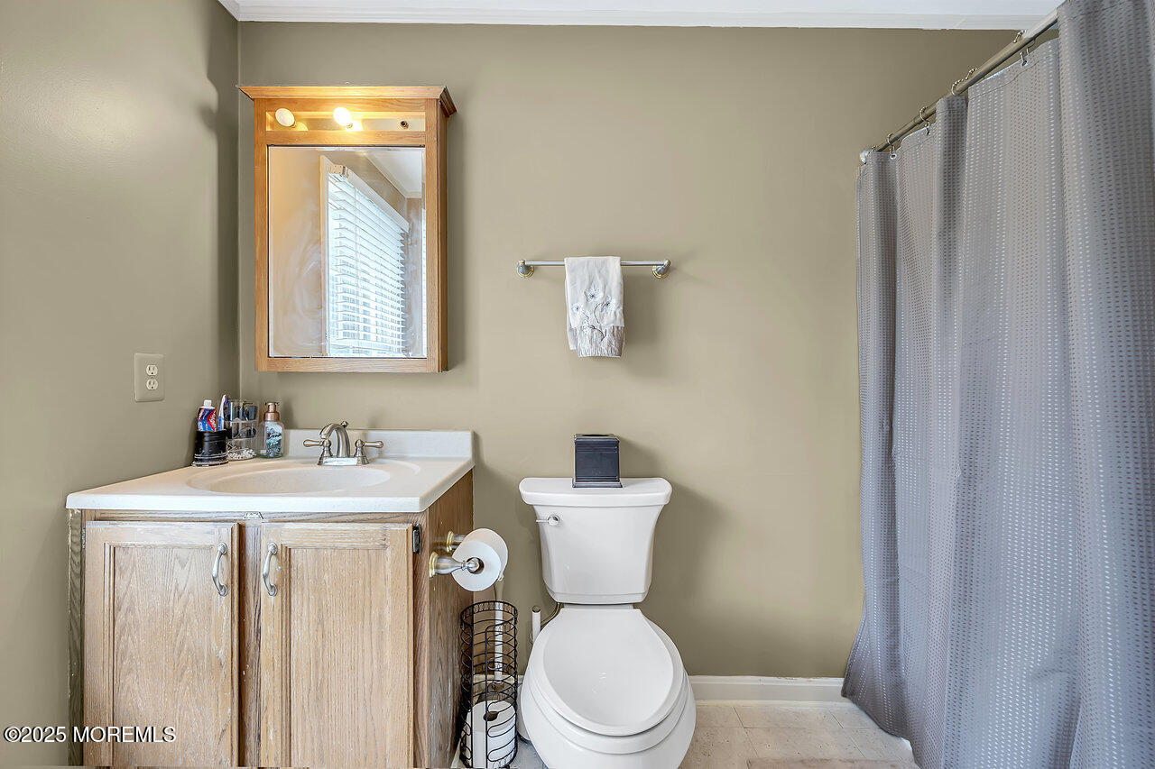 4 Cranberry Court Cream Ridge, NJ 08514 - Photo 27 of 51 a bathroom with a toilet sink and mirror