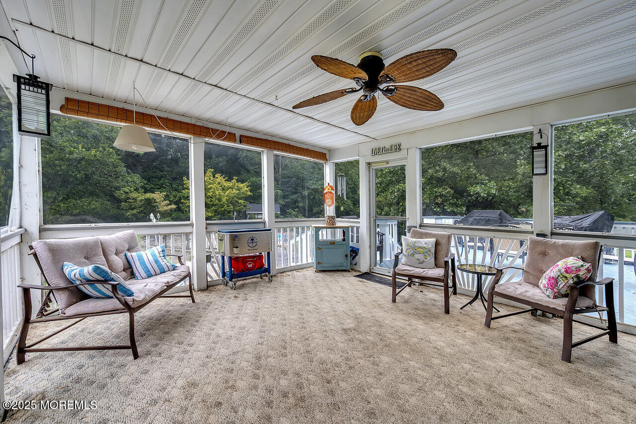 4 Cranberry Court Cream Ridge, NJ 08514 - Photo 37 of 51 a living room with furniture a ceiling fan and a large window