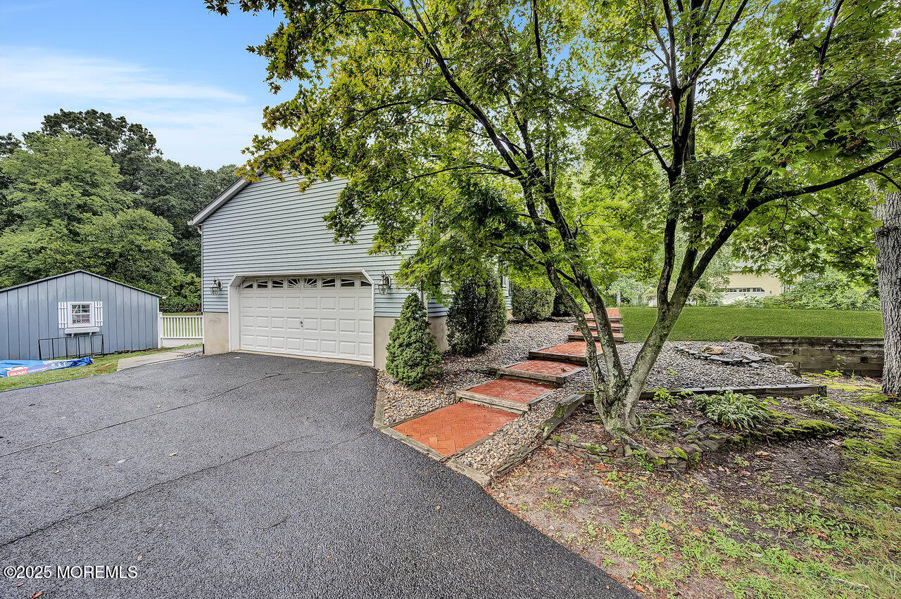 4 Cranberry Court Cream Ridge, NJ 08514 - Photo 49 of 51 a view of backyard with a barn and large trees