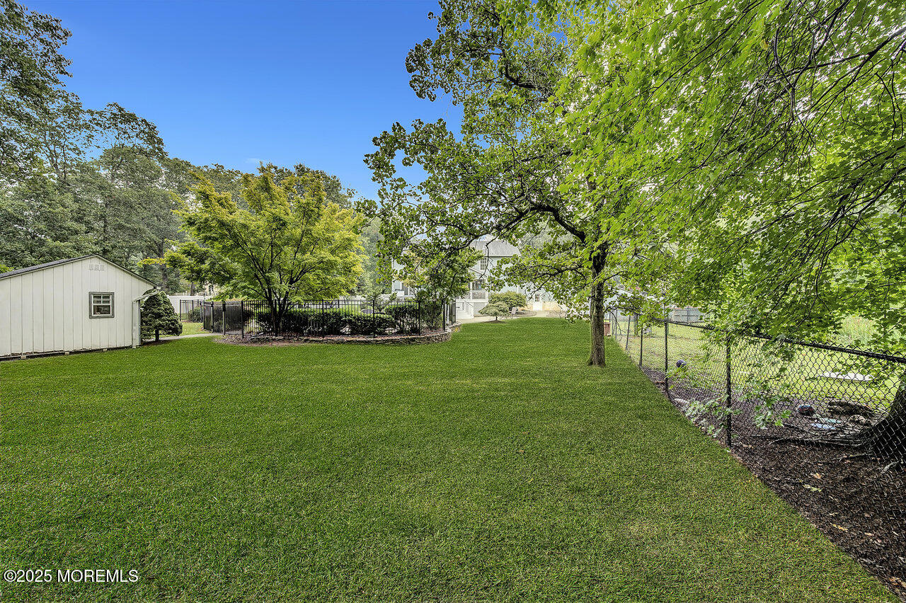 4 Cranberry Court Cream Ridge, NJ 08514 - Photo 51 of 51 a view of a white house with a big yard and large trees