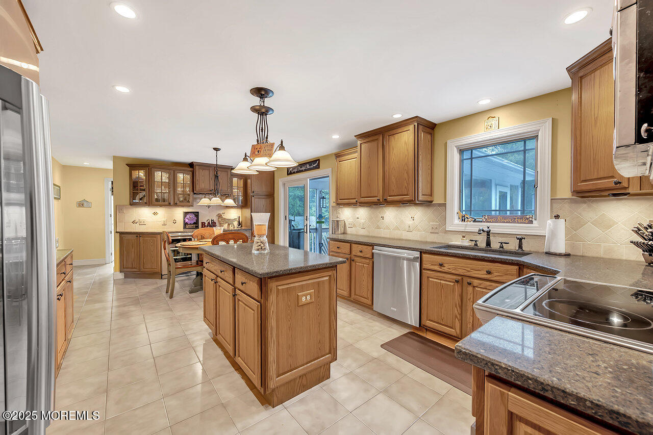 4 Cranberry Court Cream Ridge, NJ 08514 - Photo 8 of 51 a kitchen with stainless steel appliances granite countertop a sink stove and refrigerator