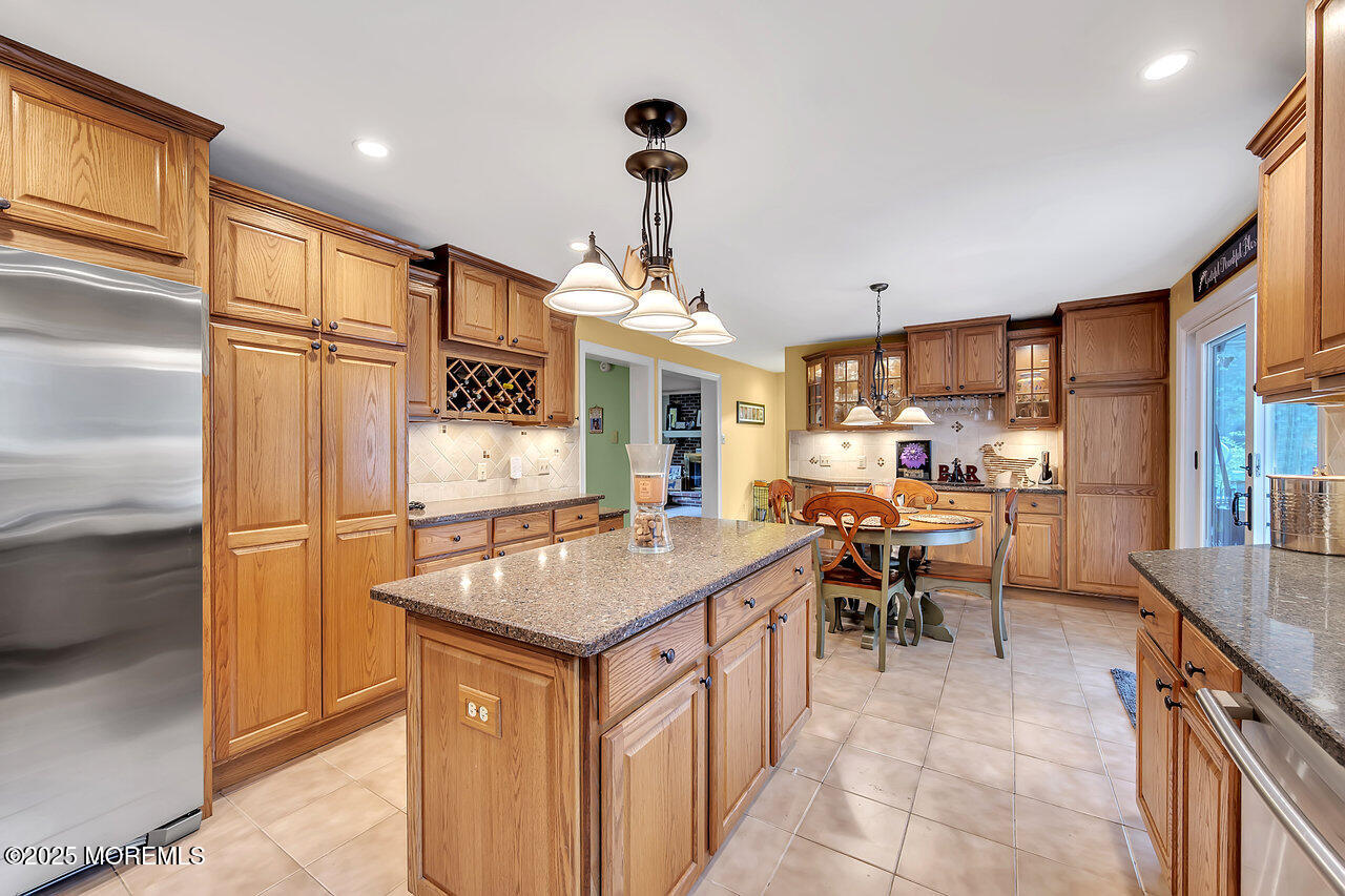 4 Cranberry Court Cream Ridge, NJ 08514 - Photo 9 of 51 a kitchen with stainless steel appliances granite countertop a sink and a refrigerator