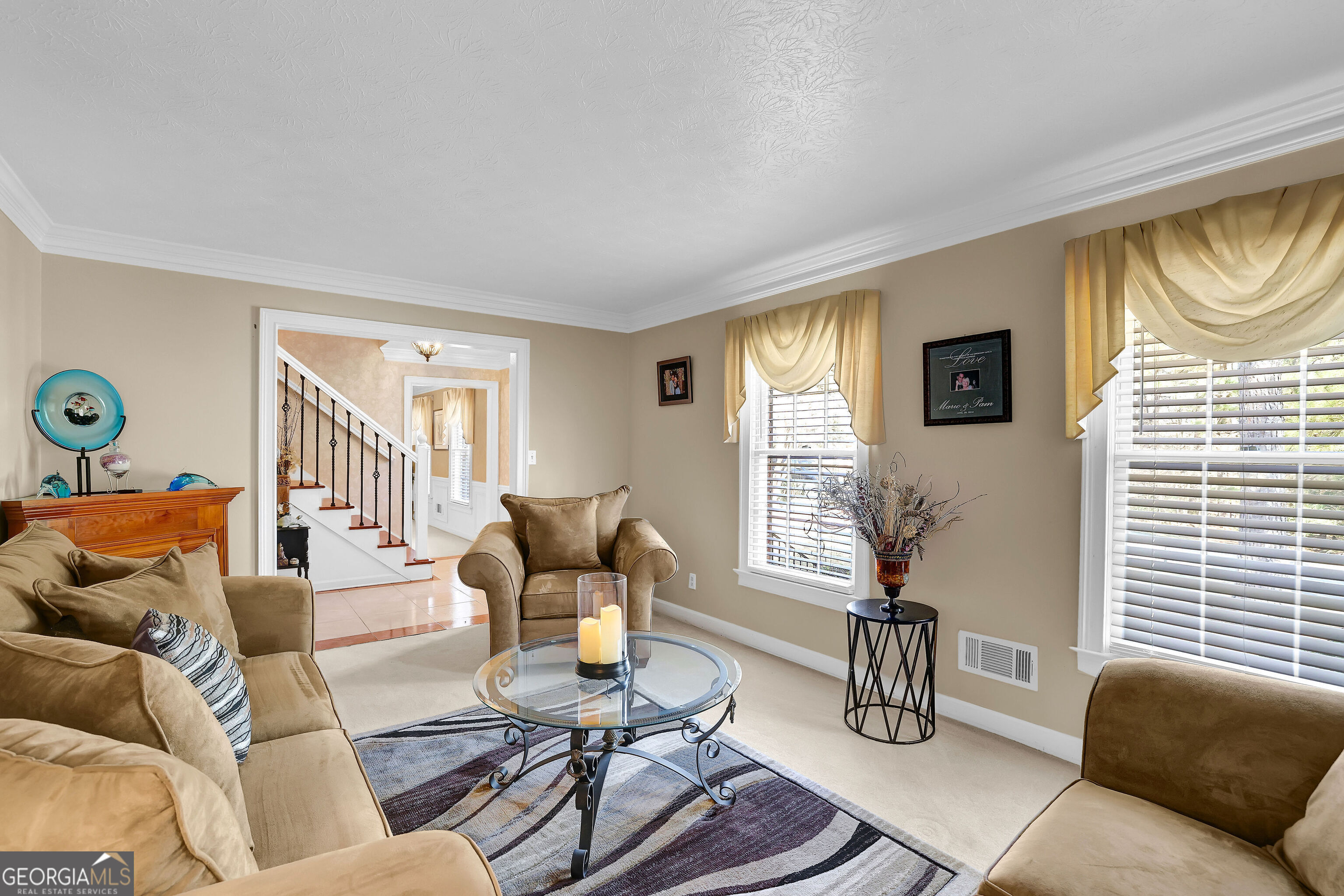 2613 Travois Way Southwest Lilburn, GA 30047 - Photo 12 of 40 a living room with furniture and a window
