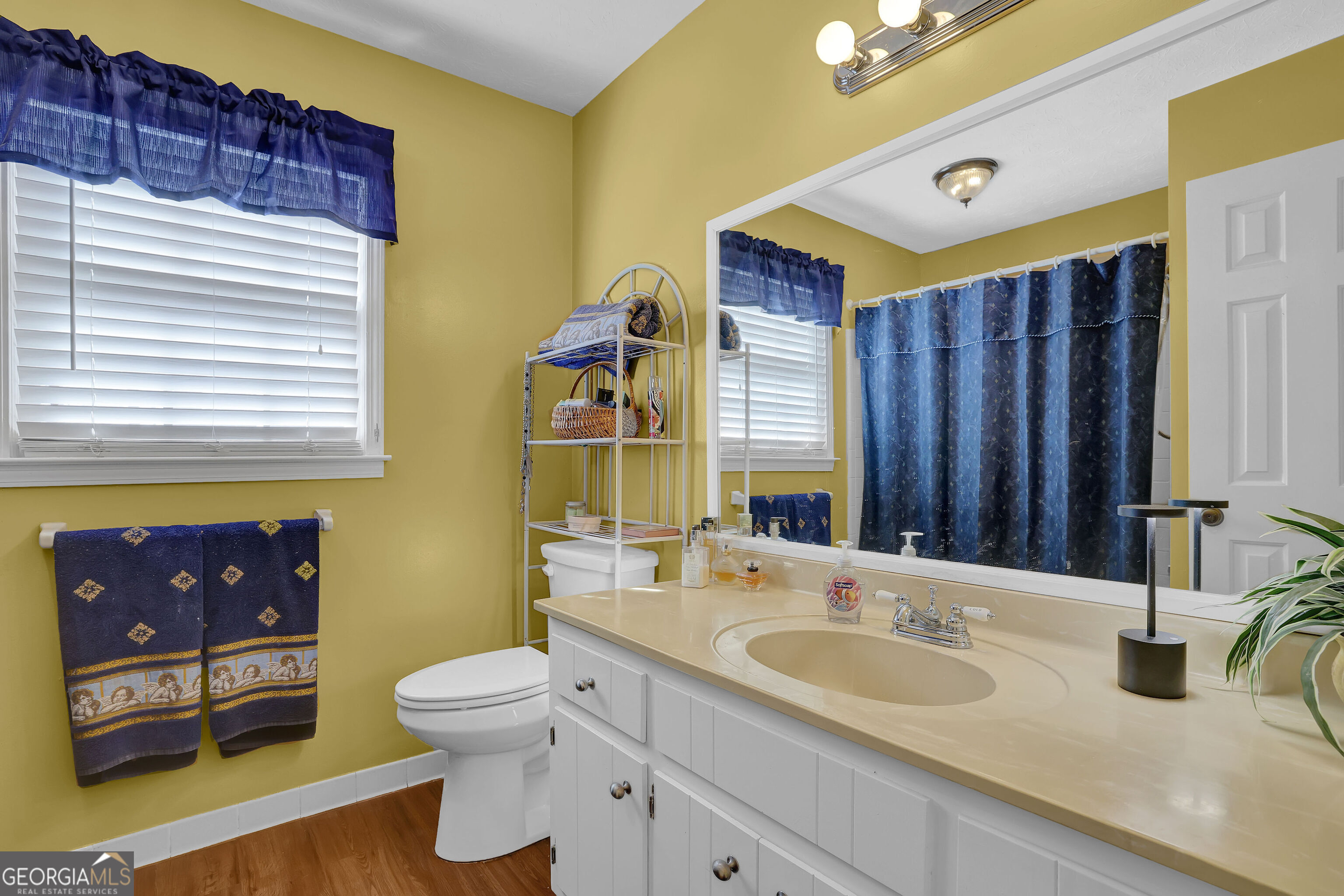 2613 Travois Way Southwest Lilburn, GA 30047 - Photo 15 of 40 a bathroom with a toilet sink and mirror