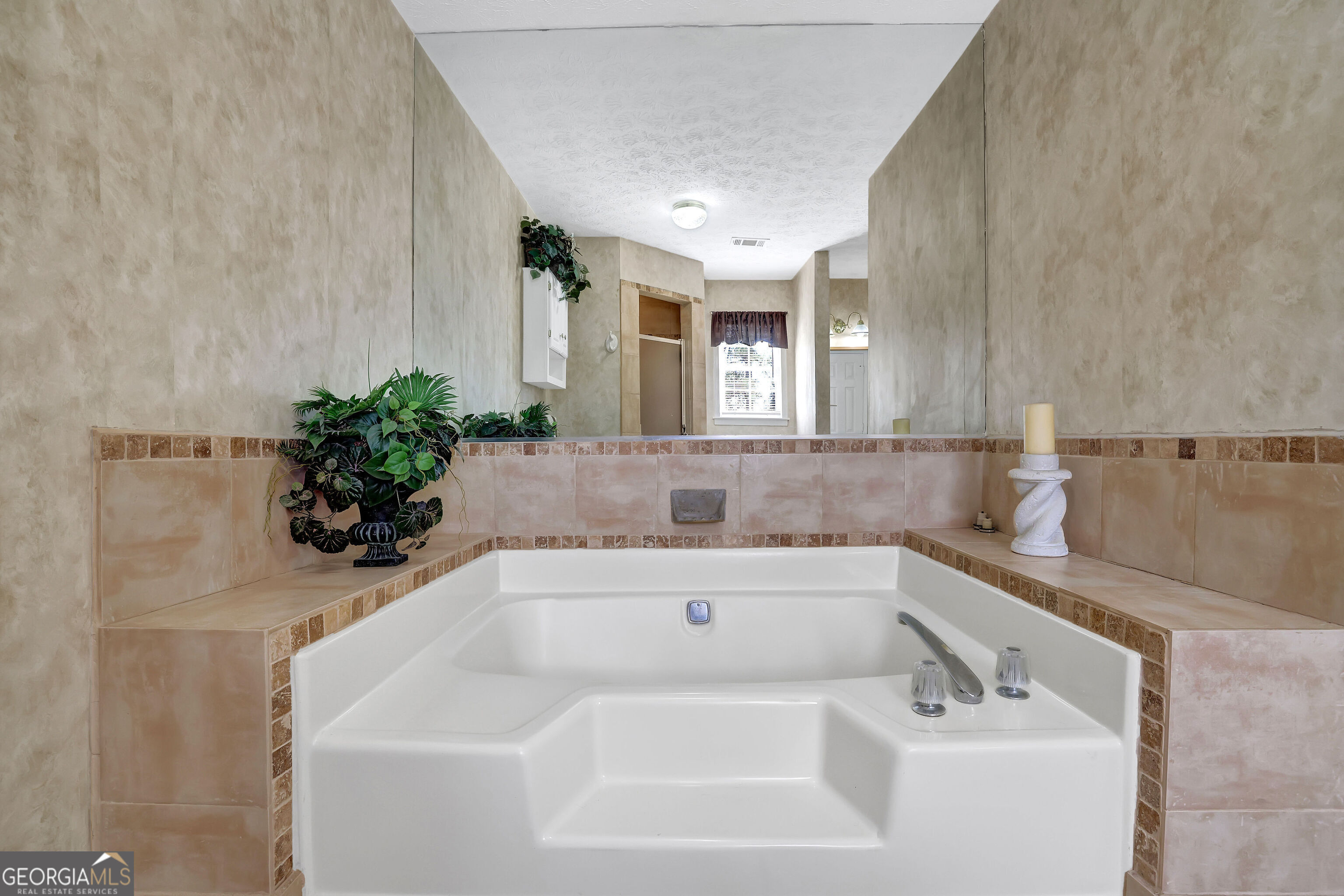 2613 Travois Way Southwest Lilburn, GA 30047 - Photo 24 of 40 a bathroom with a sink and a bathtub