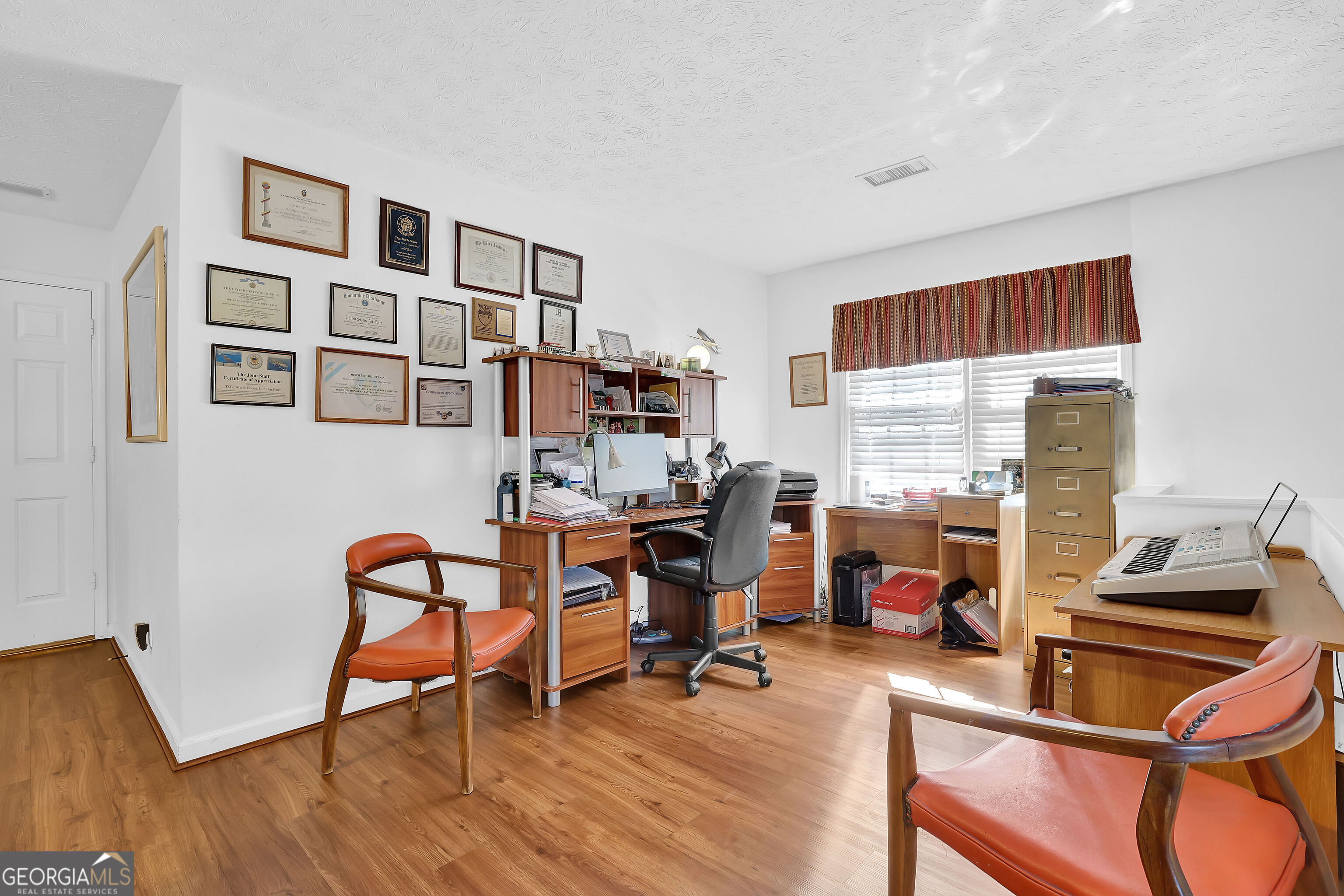 2613 Travois Way Southwest Lilburn, GA 30047 - Photo 26 of 40 a work room with furniture and wooden floor