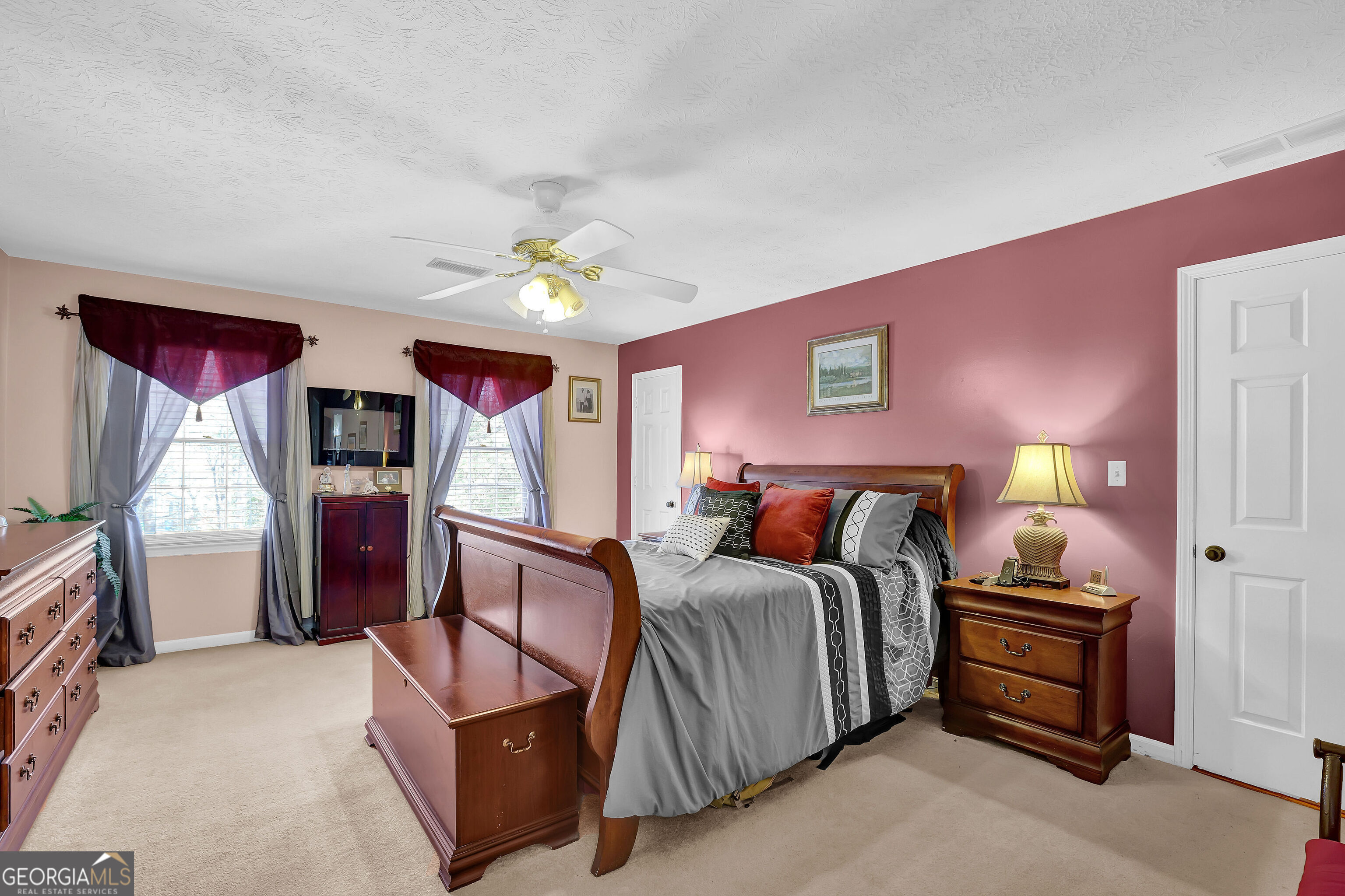 2613 Travois Way Southwest Lilburn, GA 30047 - Photo 27 of 40 a bed room with a bed and a tv