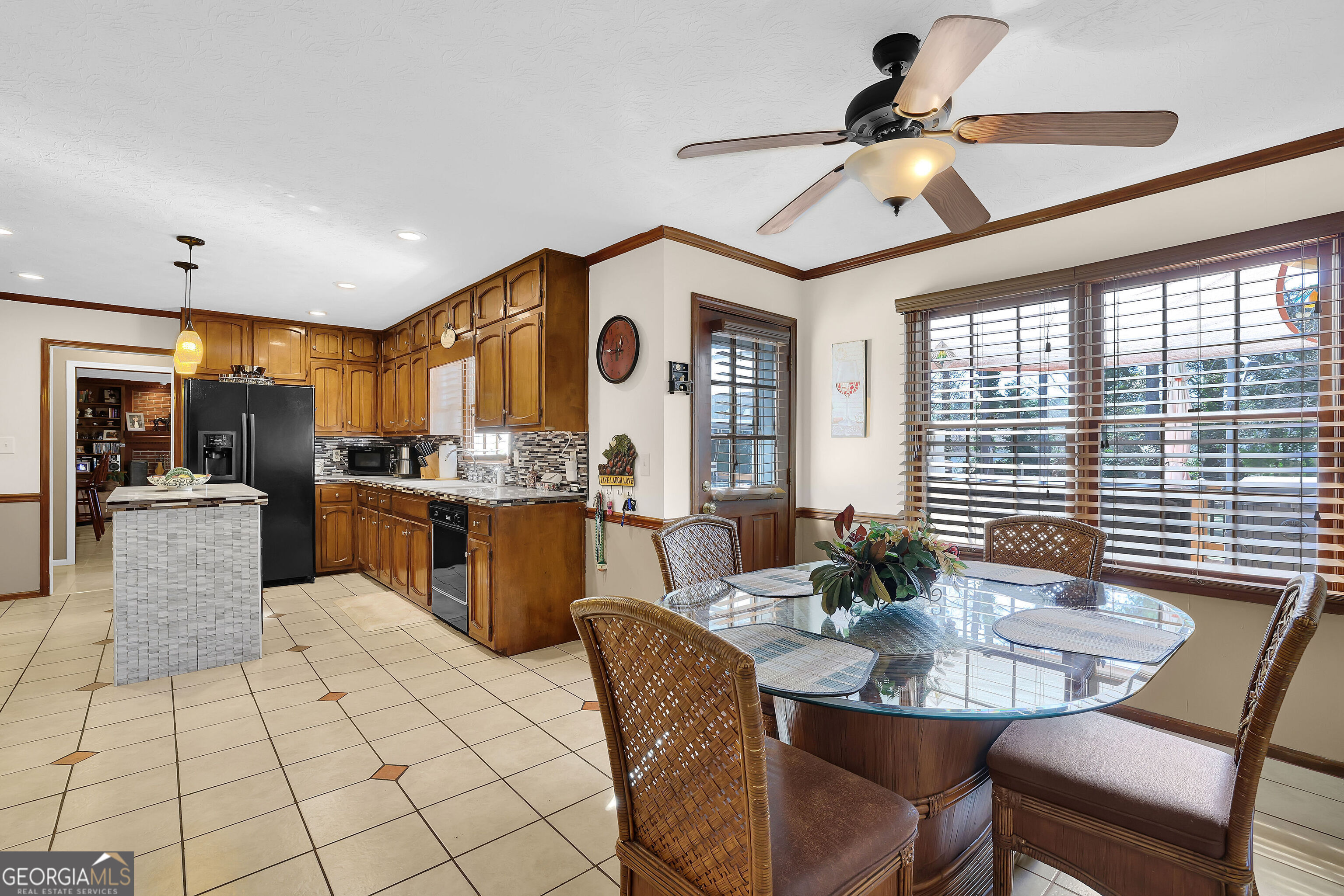 2613 Travois Way Southwest Lilburn, GA 30047 - Photo 30 of 40 a kitchen with stainless steel appliances kitchen island granite countertop a sink and cabinets