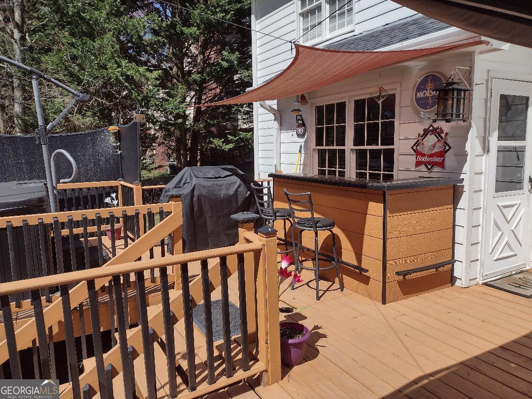 2613 Travois Way Southwest Lilburn, GA 30047 - Photo 3 of 40 a view of a deck with a bench