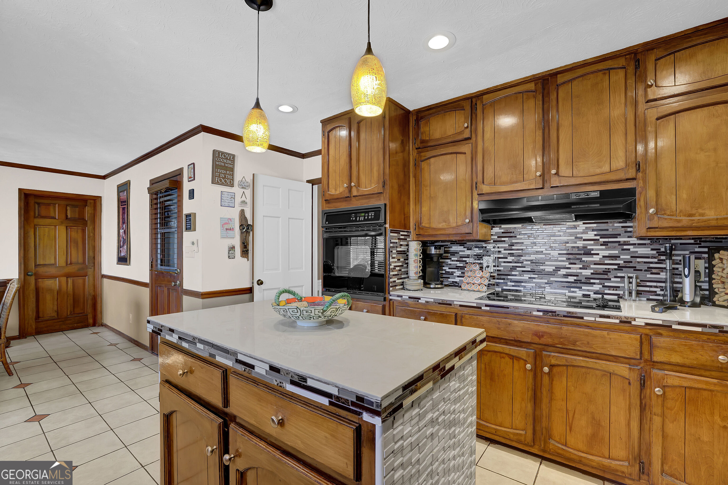 2613 Travois Way Southwest Lilburn, GA 30047 - Photo 33 of 40 a kitchen with a sink a counter space cabinets and appliances