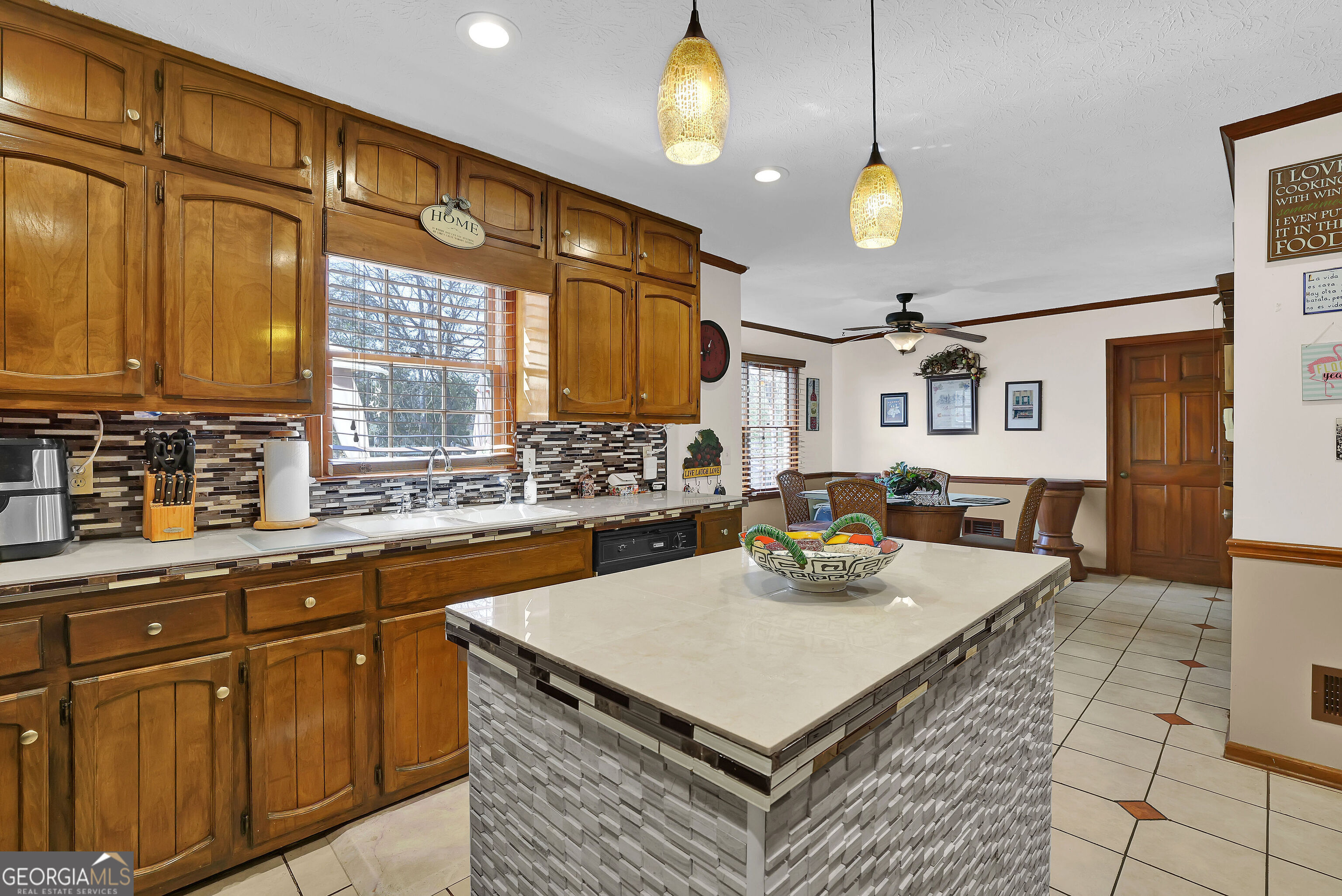 2613 Travois Way Southwest Lilburn, GA 30047 - Photo 34 of 40 a kitchen with cabinets and window