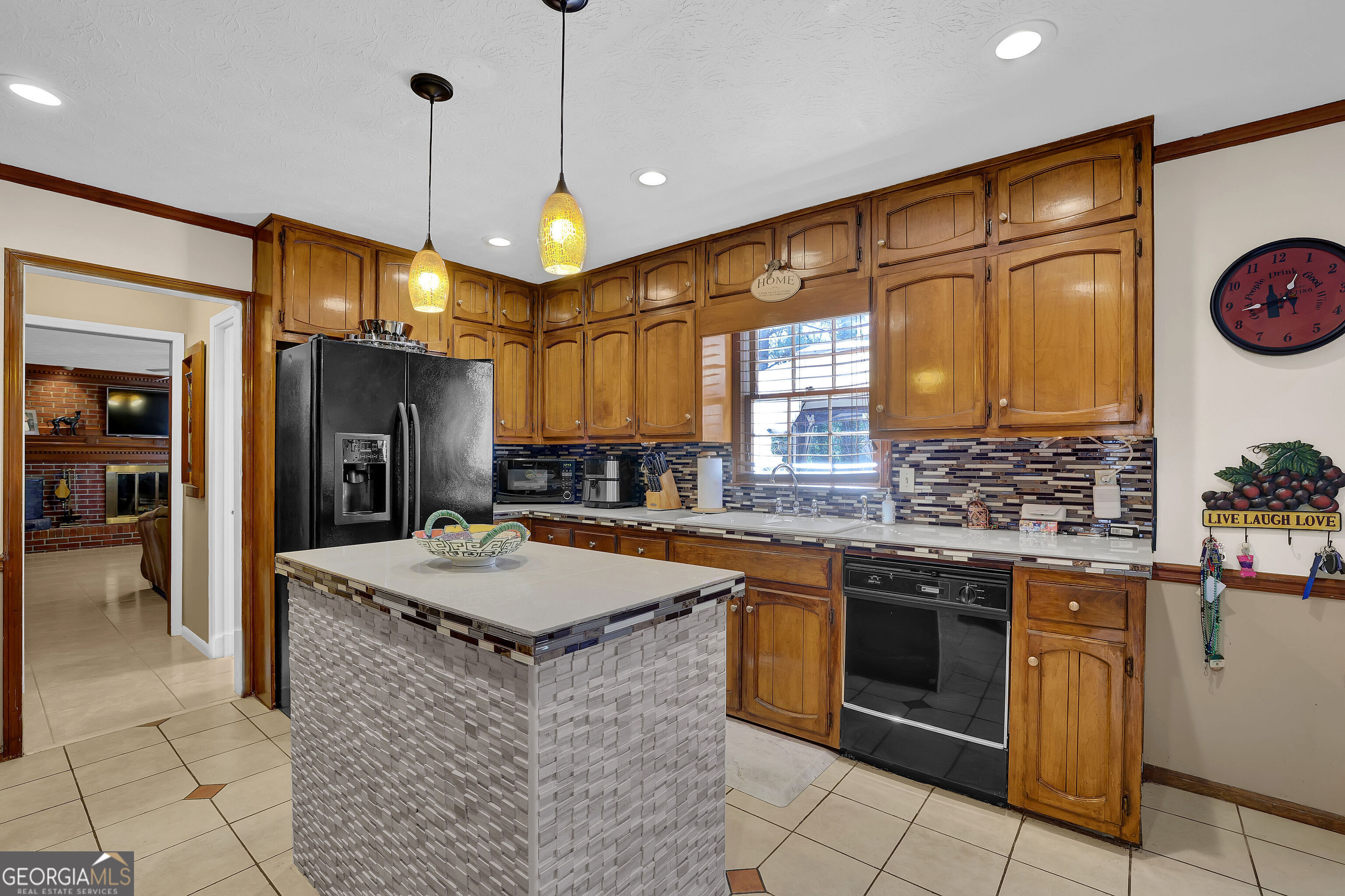 2613 Travois Way Southwest Lilburn, GA 30047 - Photo 35 of 40 a kitchen with stainless steel appliances granite countertop a sink stove and refrigerator