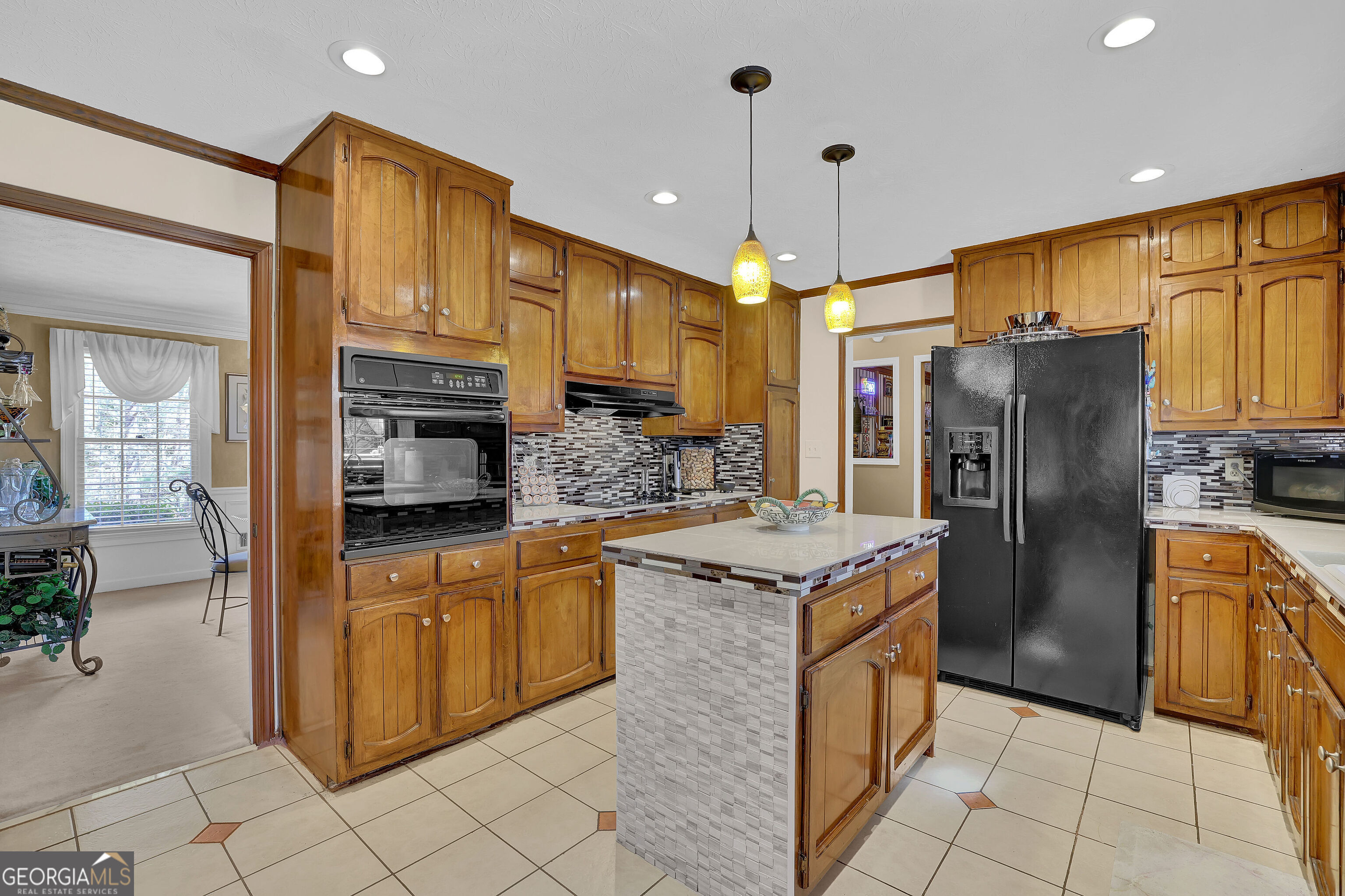 2613 Travois Way Southwest Lilburn, GA 30047 - Photo 36 of 40 a kitchen with stainless steel appliances granite countertop a refrigerator a stove and a sink