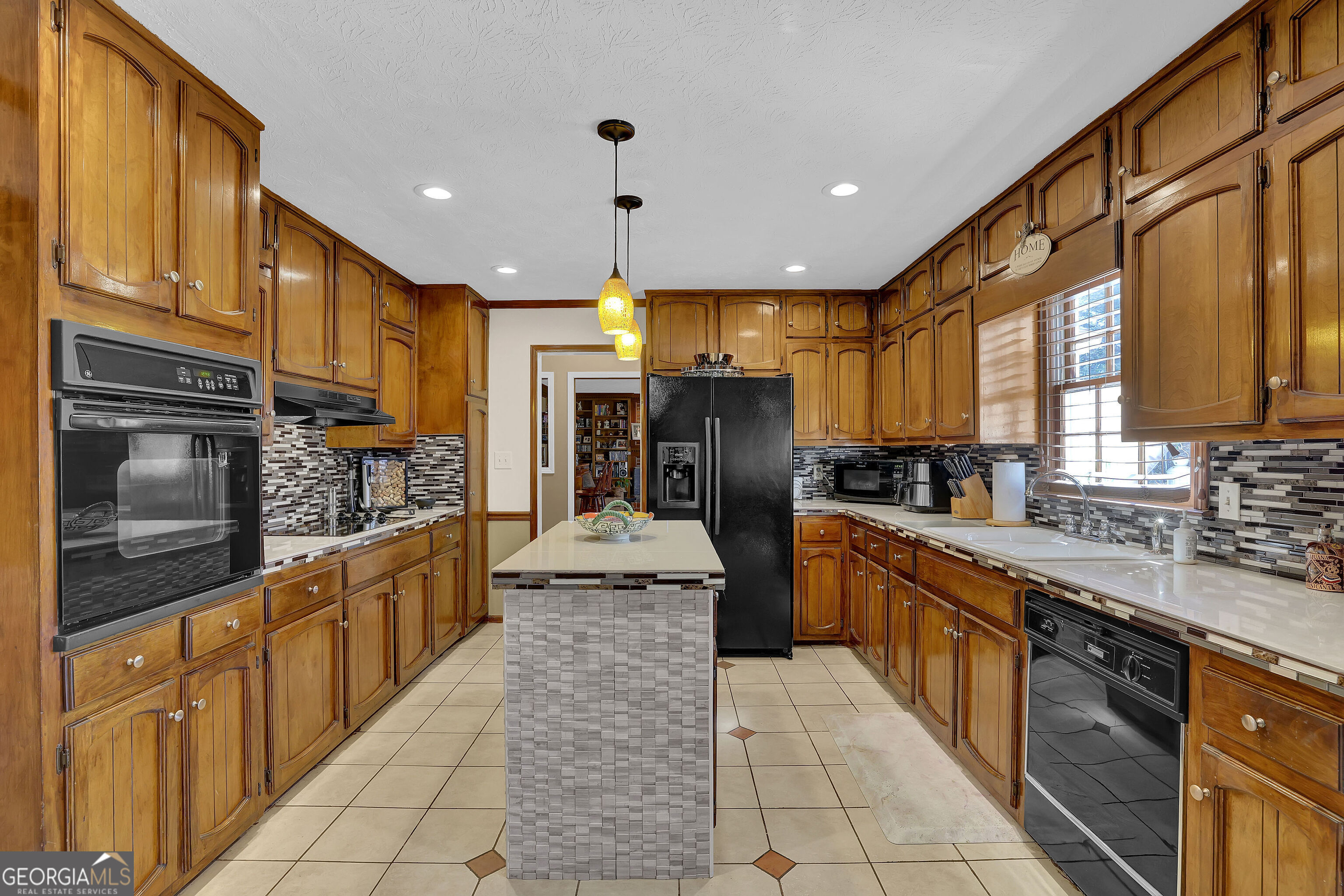 2613 Travois Way Southwest Lilburn, GA 30047 - Photo 37 of 40 a large kitchen with stainless steel appliances lots of counter top space