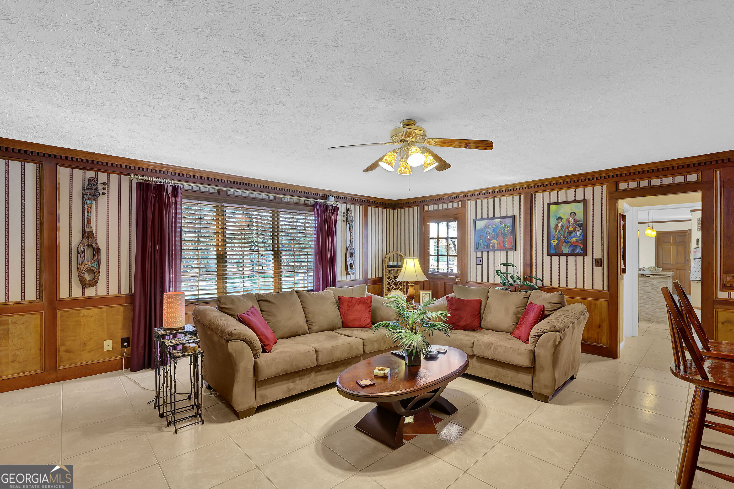 2613 Travois Way Southwest Lilburn, GA 30047 - Photo 39 of 40 a living room with furniture and a large window