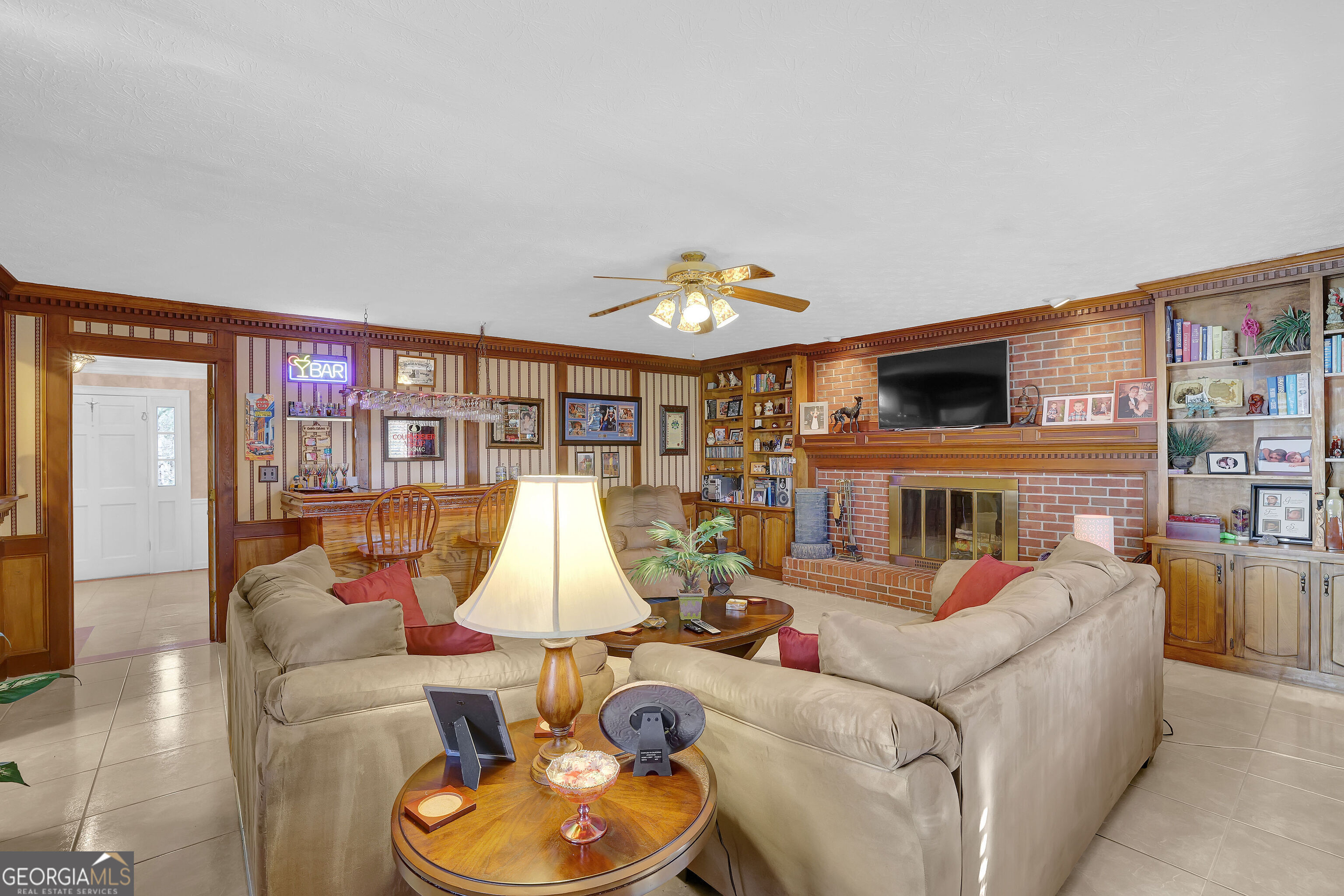 2613 Travois Way Southwest Lilburn, GA 30047 - Photo 7 of 40 a living room with furniture a window and kitchen view